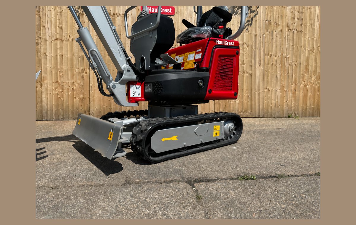 CREX10-K dozer blade and rubber tracks from the side