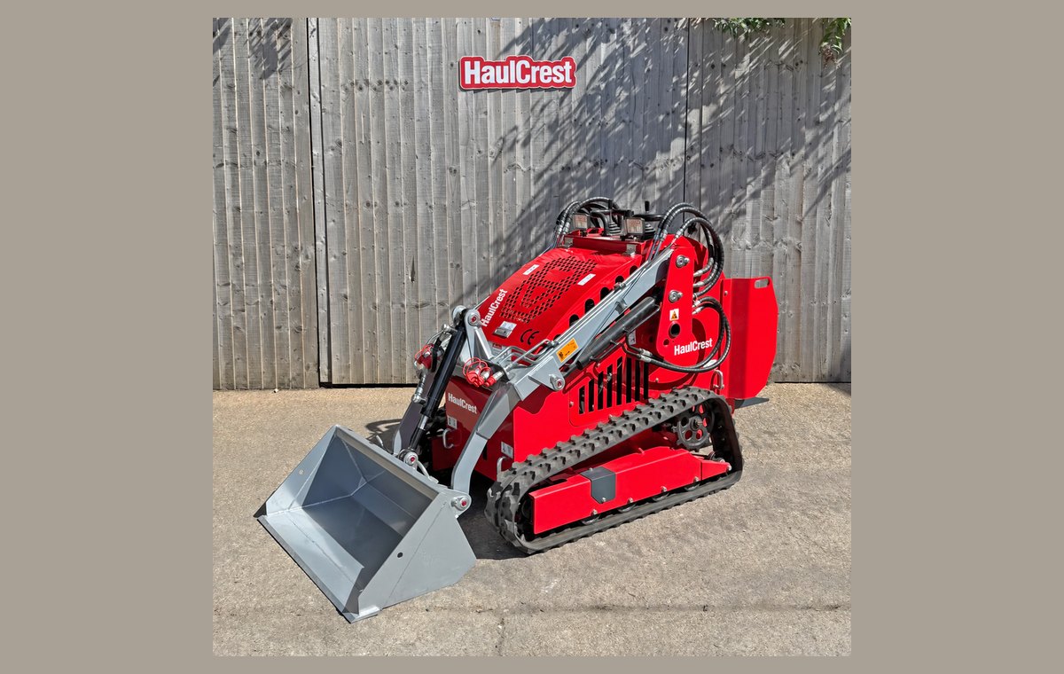 HaulCrest mini skid steer loader with bucket, front three-quarter view