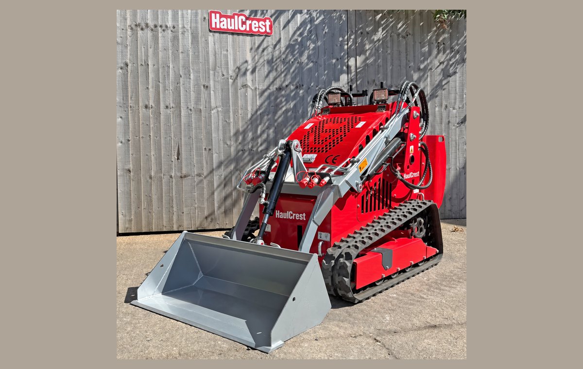 Mini skid steer front three-quarter view on rubber tracks